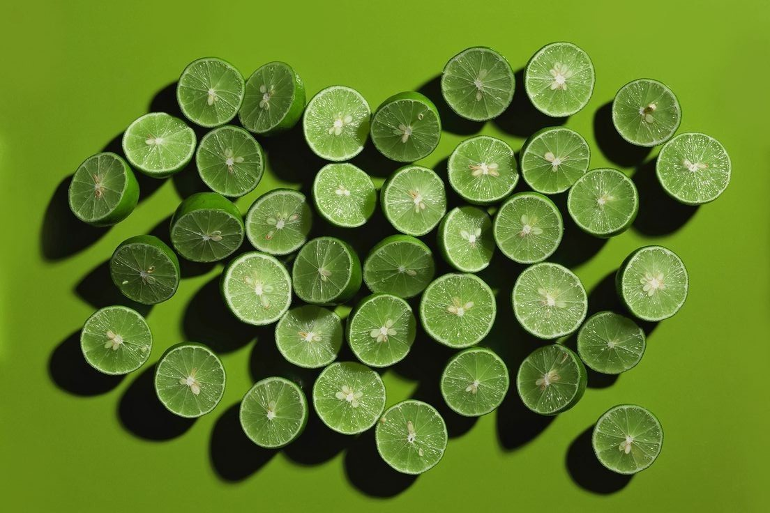 banner image, halved limes on green background