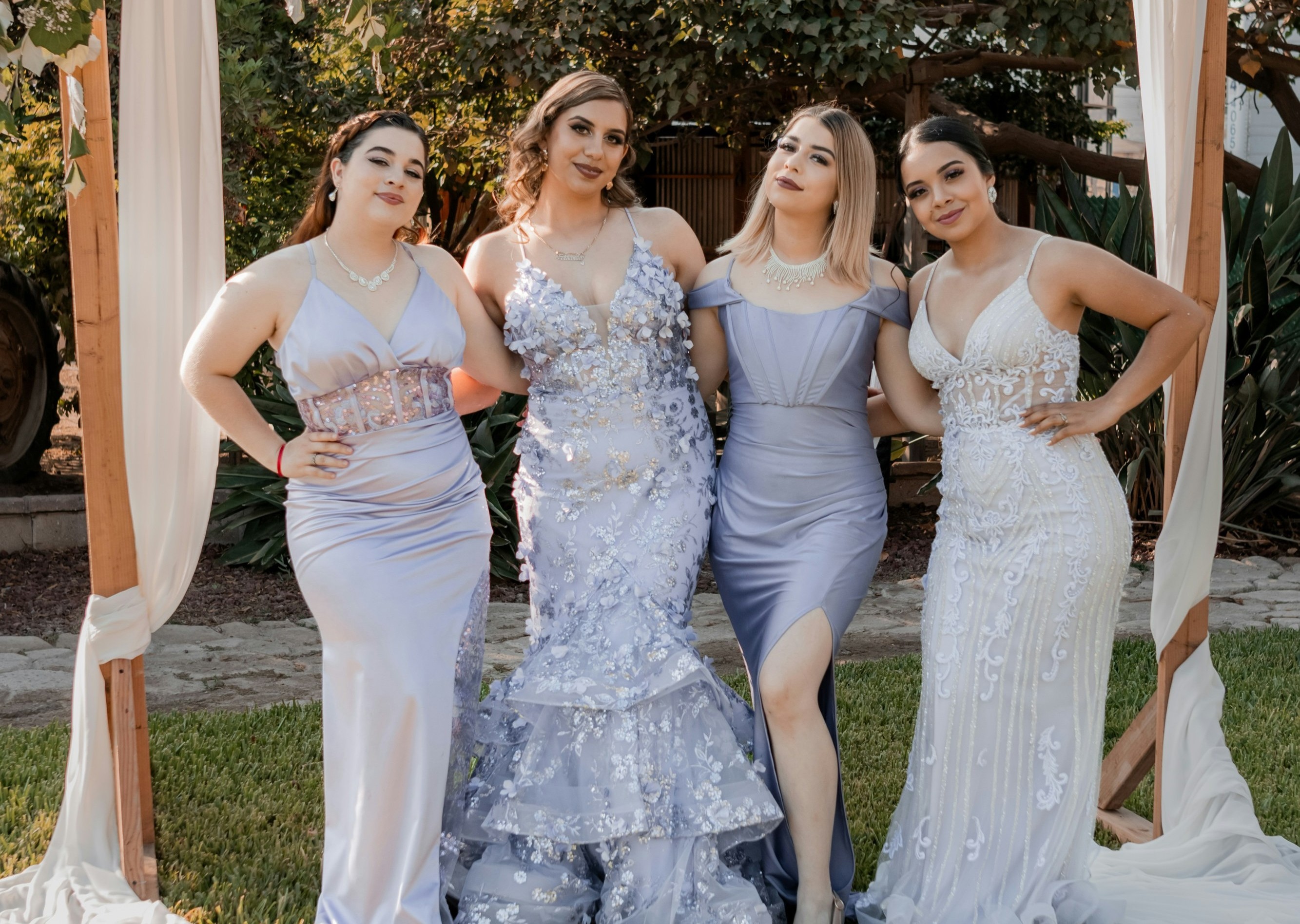 4 girls in blue/grey/white ball gowns